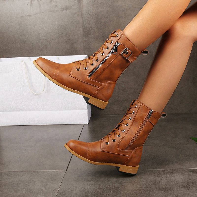 Women's tall genuine leather boots in classic black elegant silhouette with side zipper closure