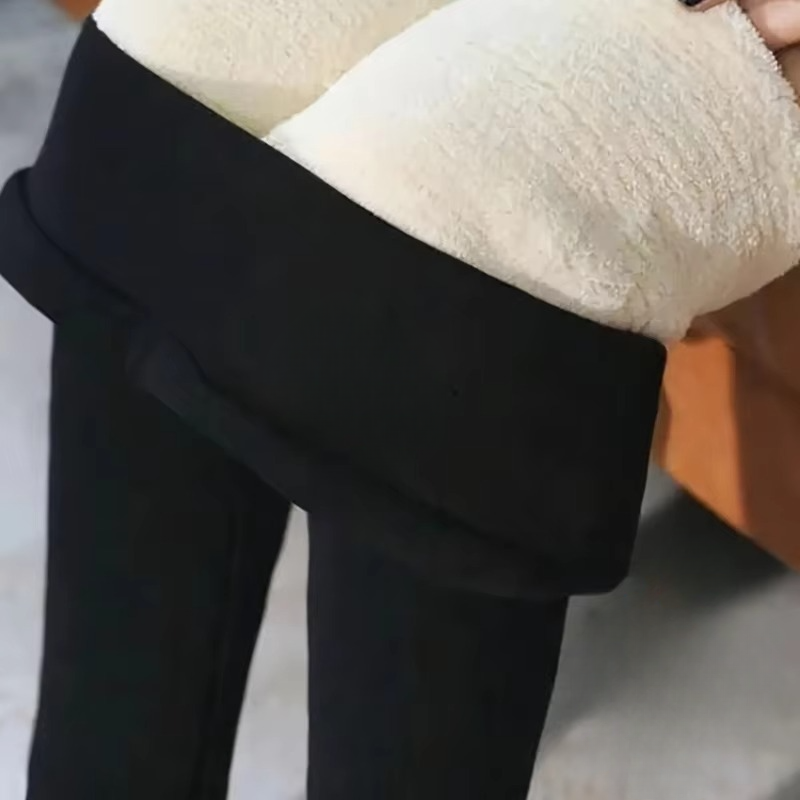Women's black high-waisted sherpa fleece-lined thermal leggings with tummy control for winter running