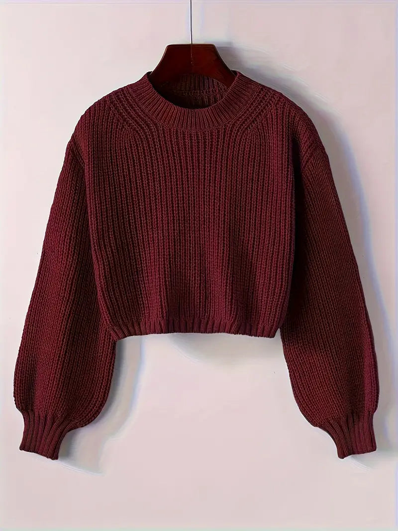 Women's cropped ribbed knit sweater in cozy winter style with modern short silhouette for layering