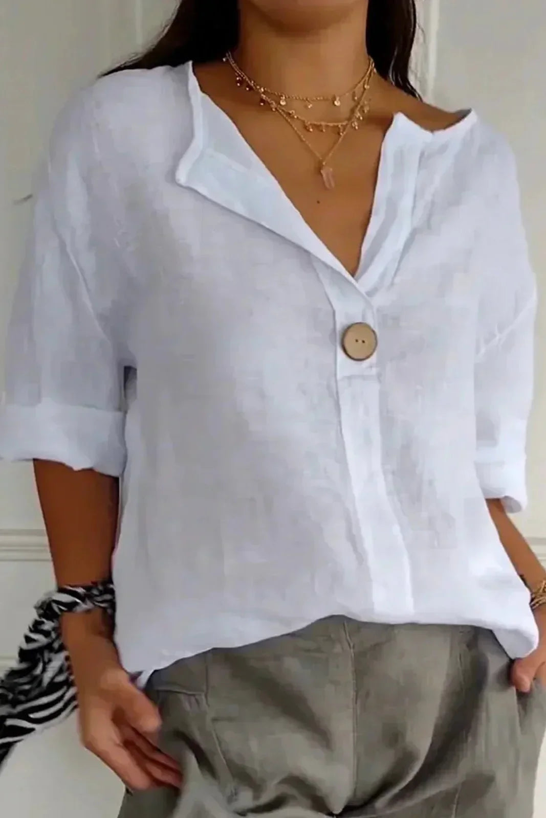 Women's relaxed blouse soft draped silhouette v-slit neckline rolled short sleeves button detail