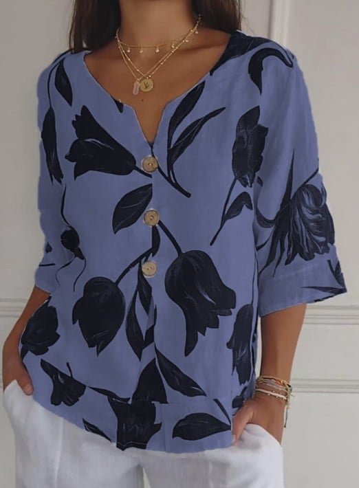 White linen-cotton V-neck blouse with vibrant red and lilac printed pattern, breathable relaxed fit