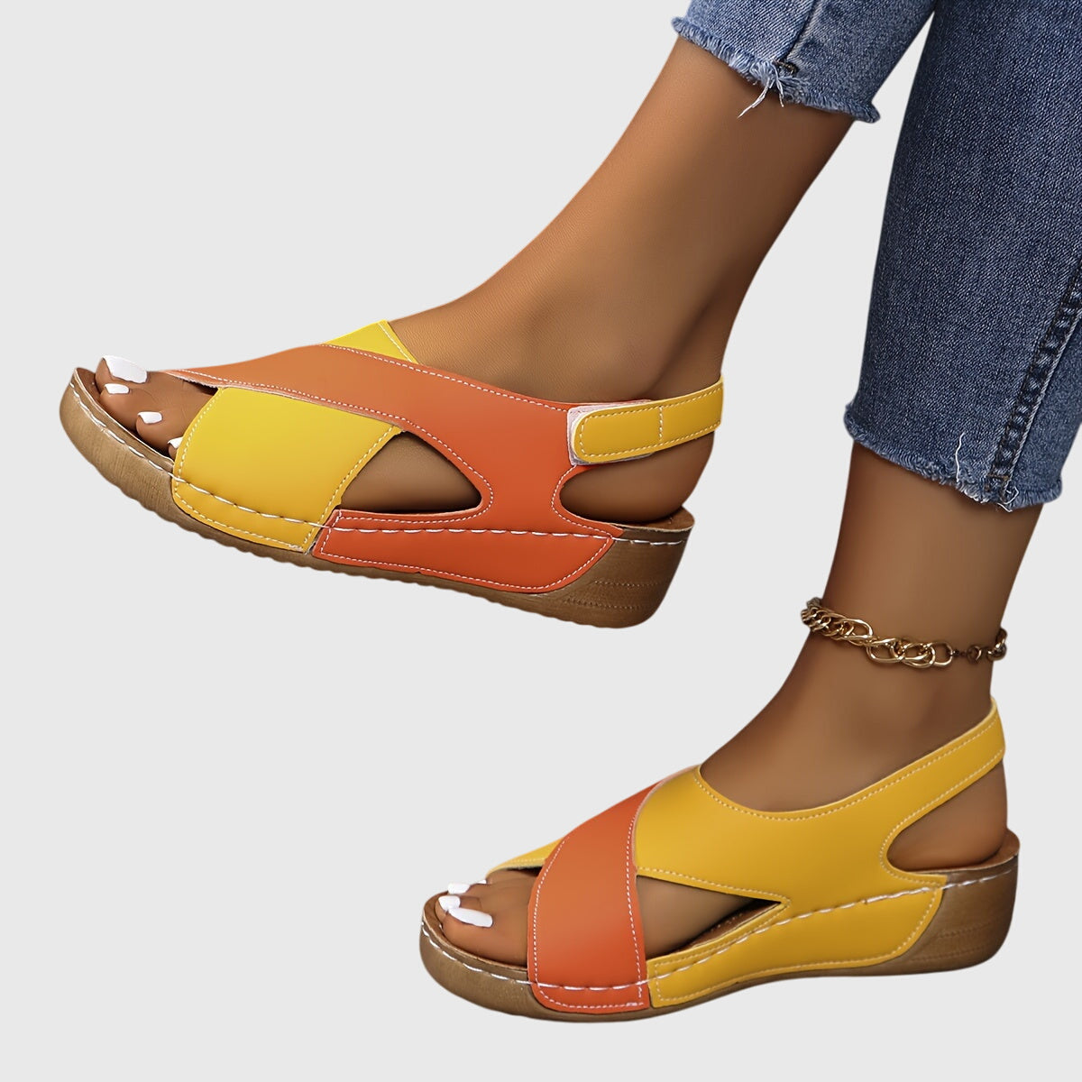 Women's open toe wedge sandals in neutral tone, casual daytime style with cushioned sole for all-day comfort