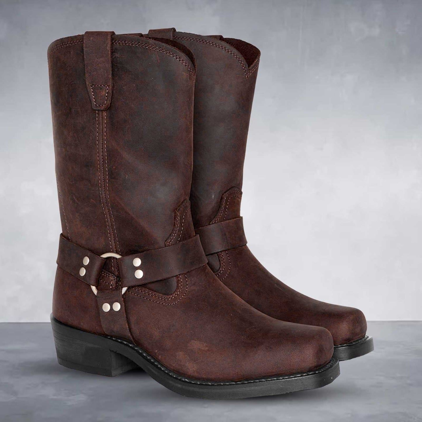 Women's brown PU leather mid-calf cowboy boots with harness strap and Western pull-on design