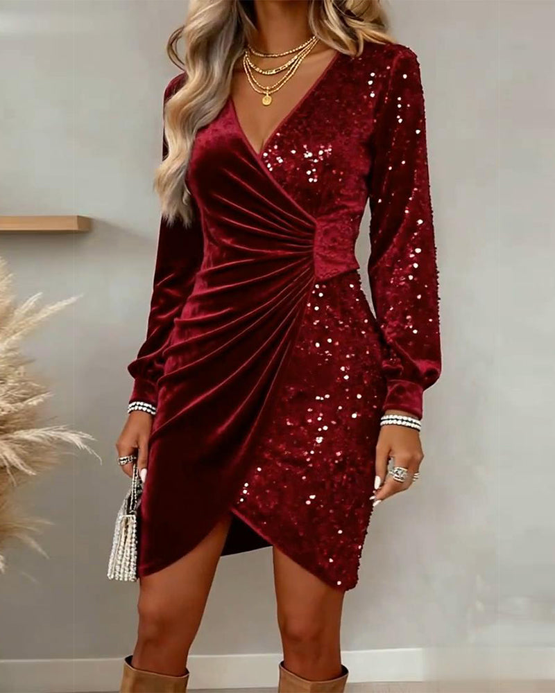 Black velvet sequin wrap mini dress with draped waist and long sleeves for festive parties