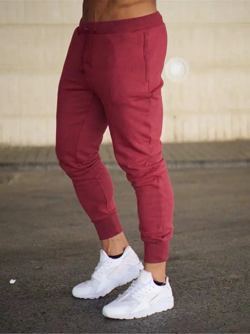 Men's casual drawstring active fit pants in neutral tone with elastic waistband for everyday comfort
