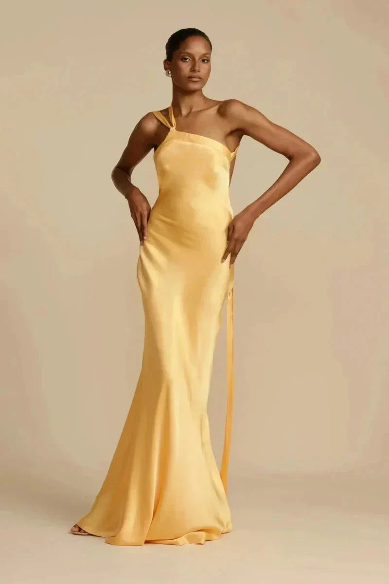 Royal blue asymmetric satin evening dress with sculpted silhouette and fluid architectural drape