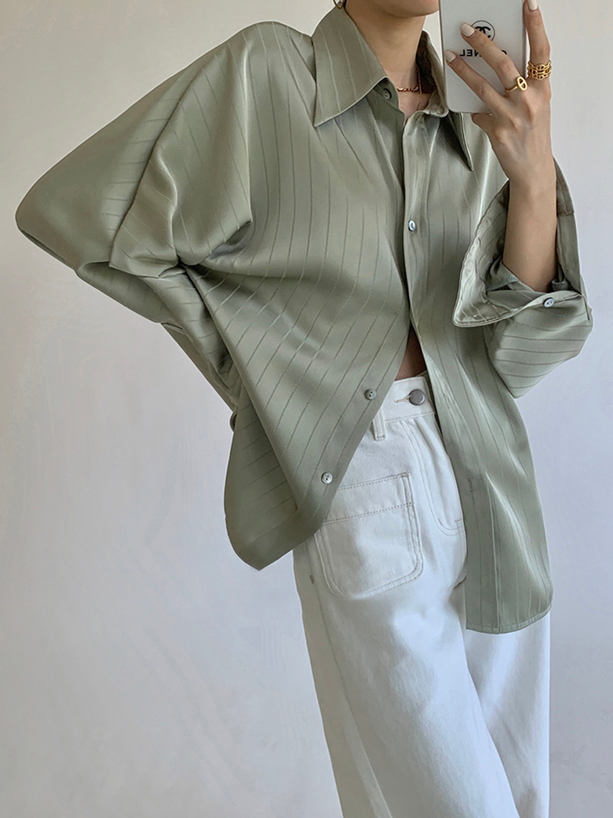 Women's oversized button-up collared shirt in elegant versatile style with smooth fluid drape