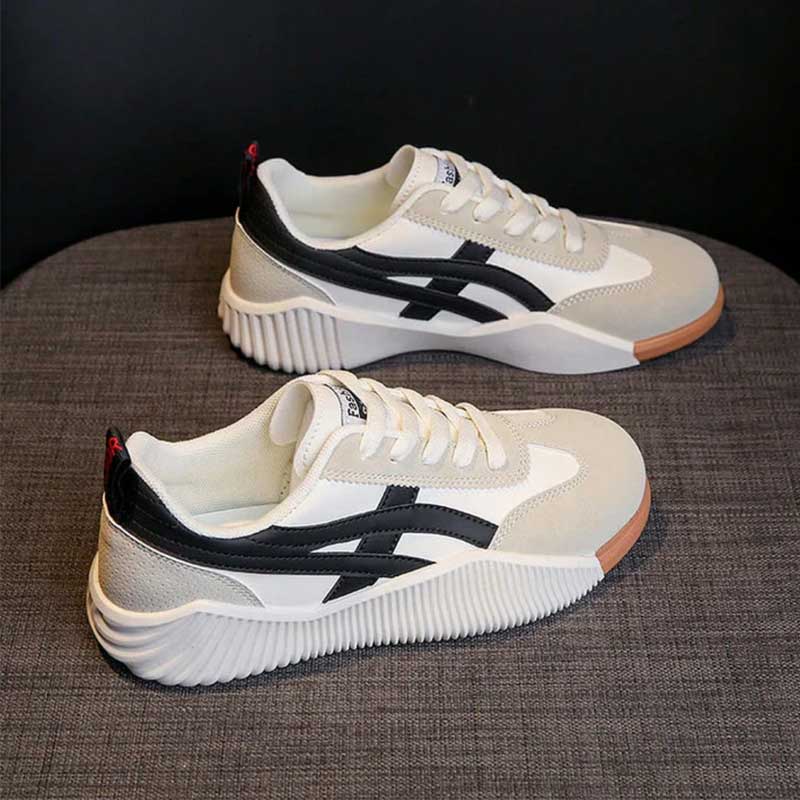 Women's lightweight walking sneakers with cushioned support, sporty silhouette, and modern two-tone design