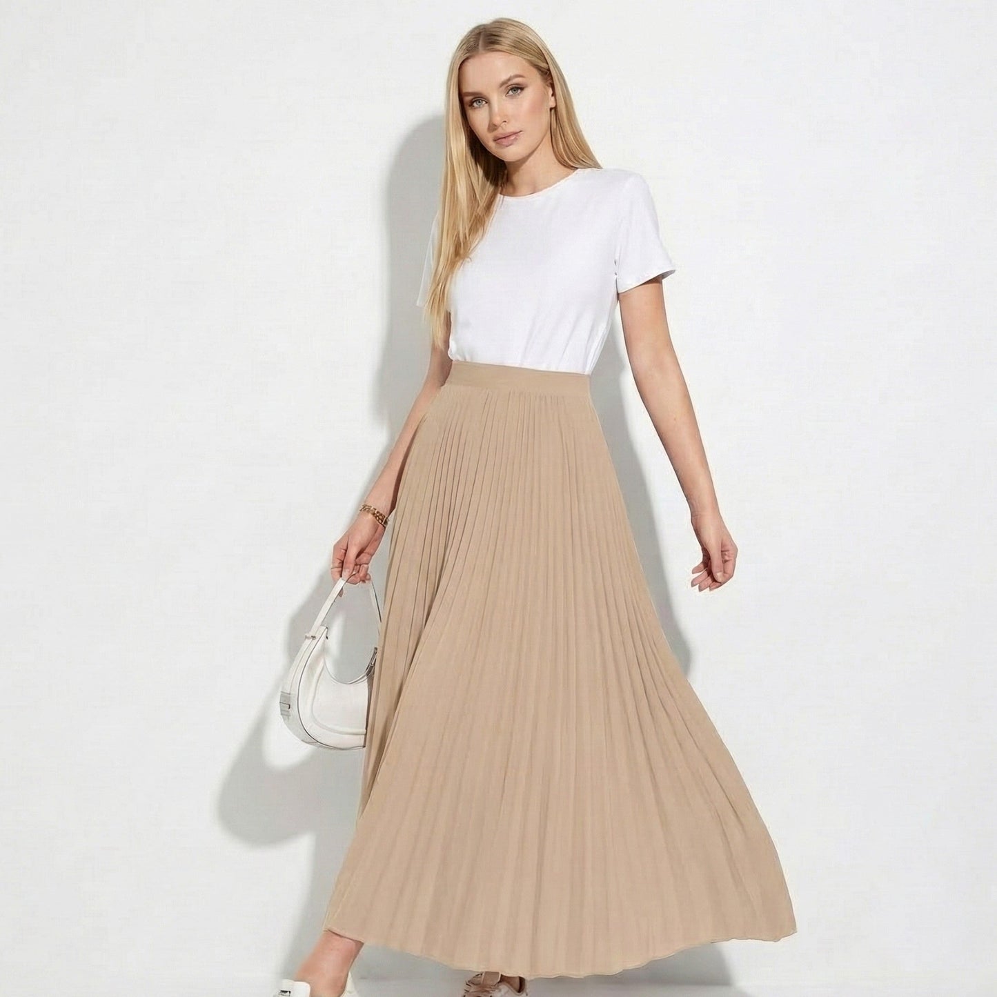 Women's high-waisted pleated satin skirt in versatile neutral tone with flattering silhouette