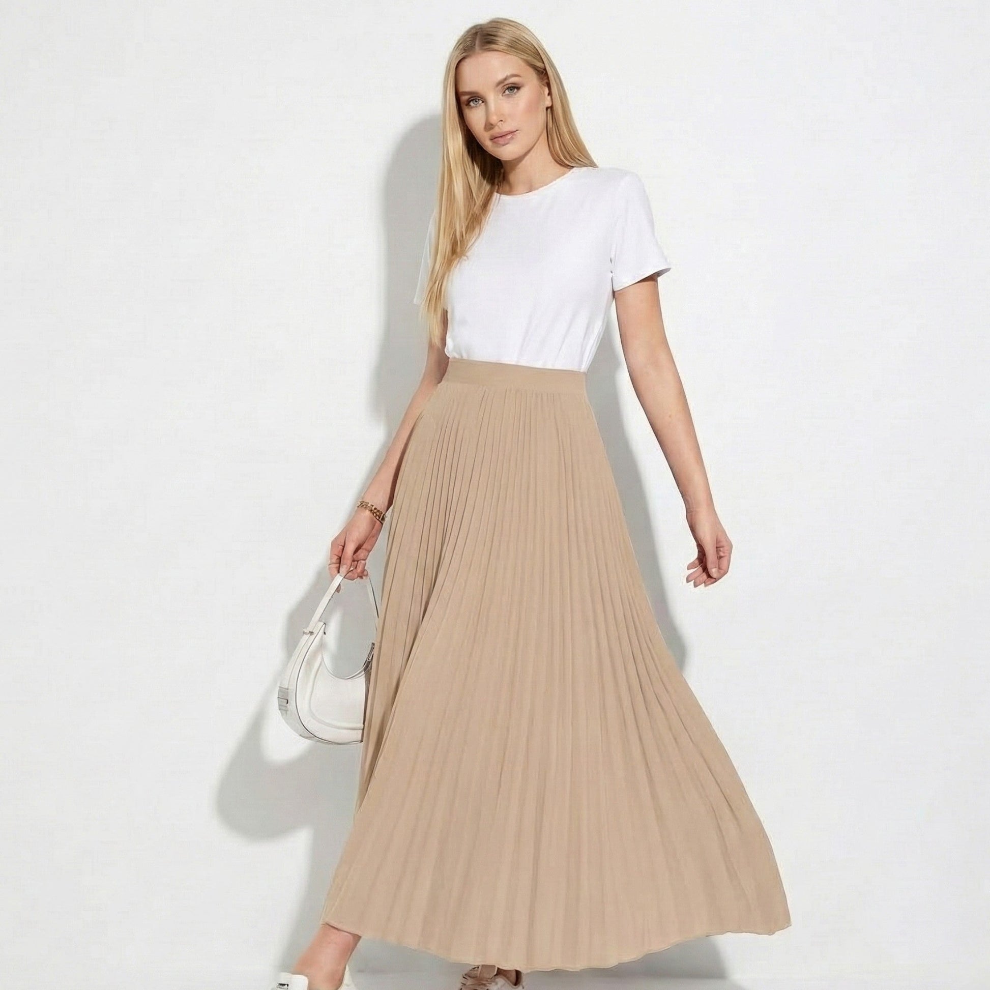 Women's high-waisted pleated satin skirt in versatile neutral tone with flattering silhouette