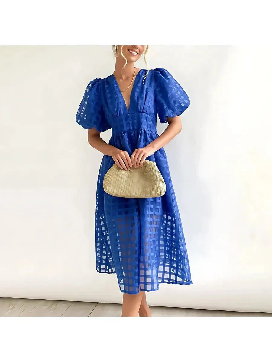 Floral patterned midi dress with puff sleeves, classic vintage silhouette, garden party chic style