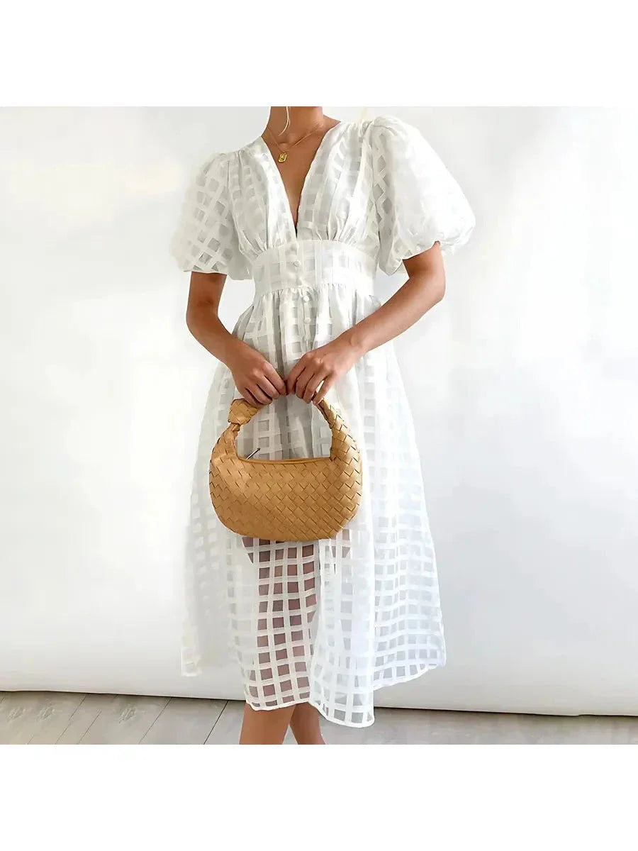Floral patterned midi dress with puff sleeves, cinched waist, vintage-inspired chic silhouette for women