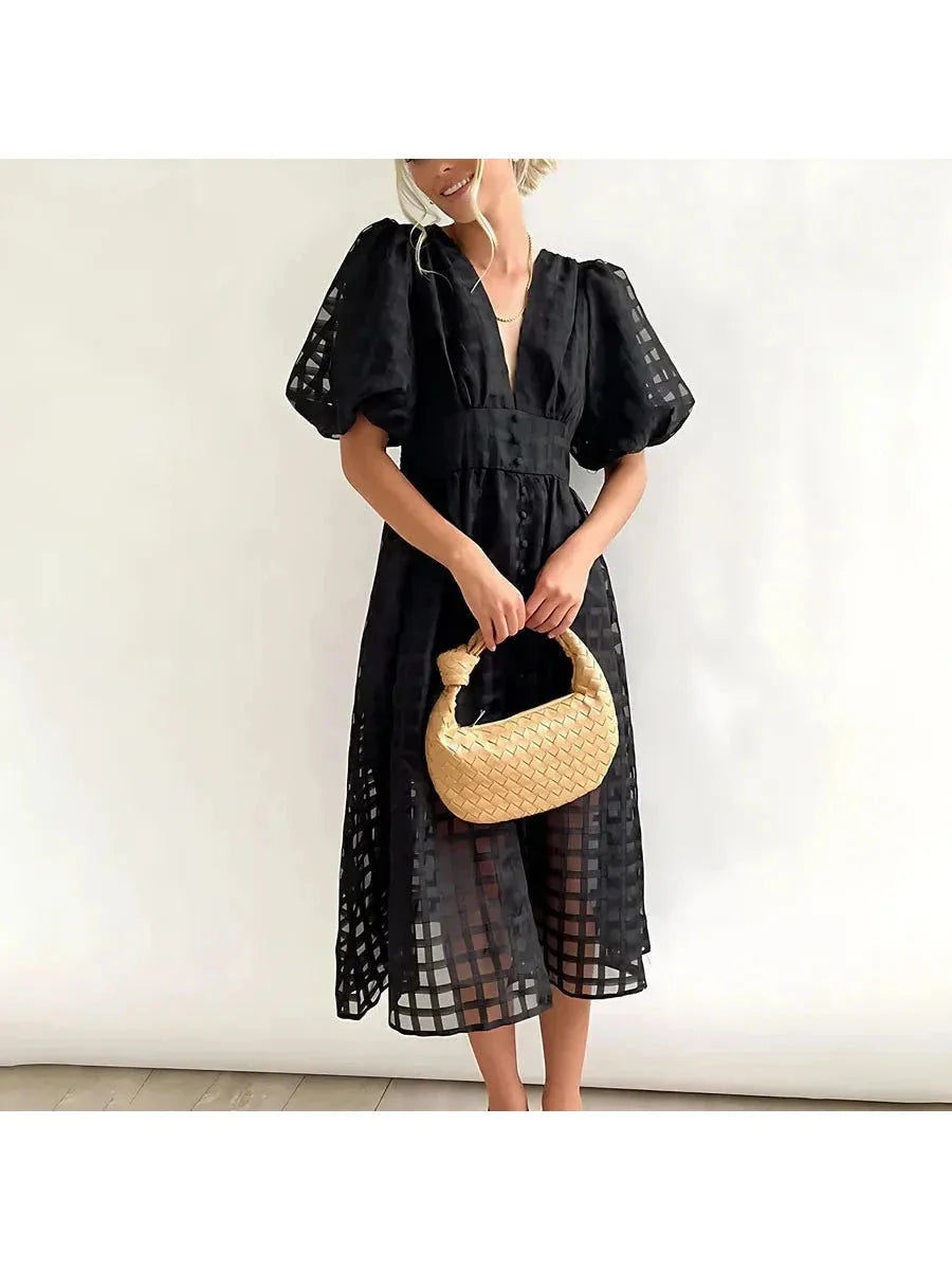 Floral patterned midi dress with puff sleeves, vintage-inspired silhouette, perfect for garden parties