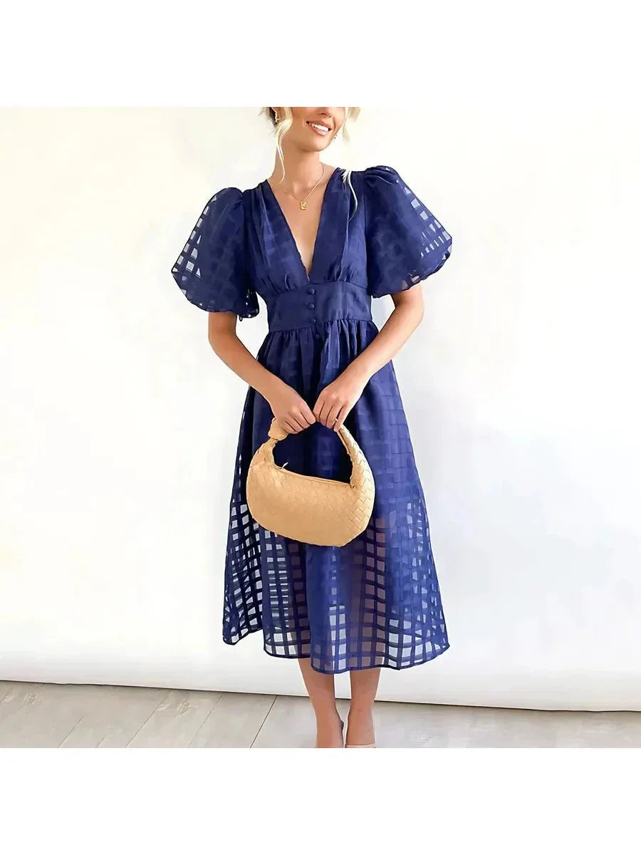 Floral patterned midi dress with puff sleeves, vintage-inspired romantic silhouette for garden parties