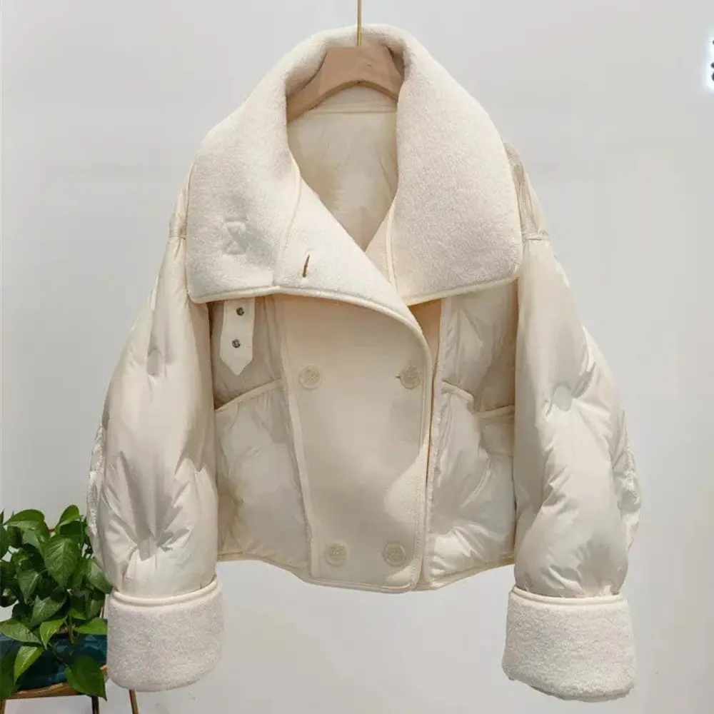 Women's black double-breasted aviator jacket with 90% white duck down insulation and sleek polyester shell