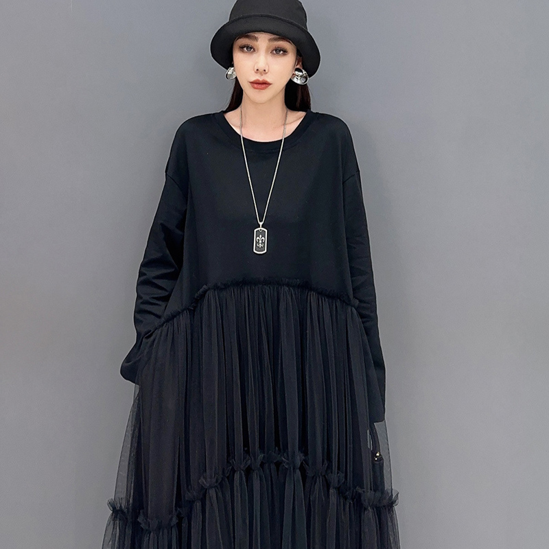 Black patchwork mesh dress with flowing folds, loose fit, sheer accents for day-to-night elegance