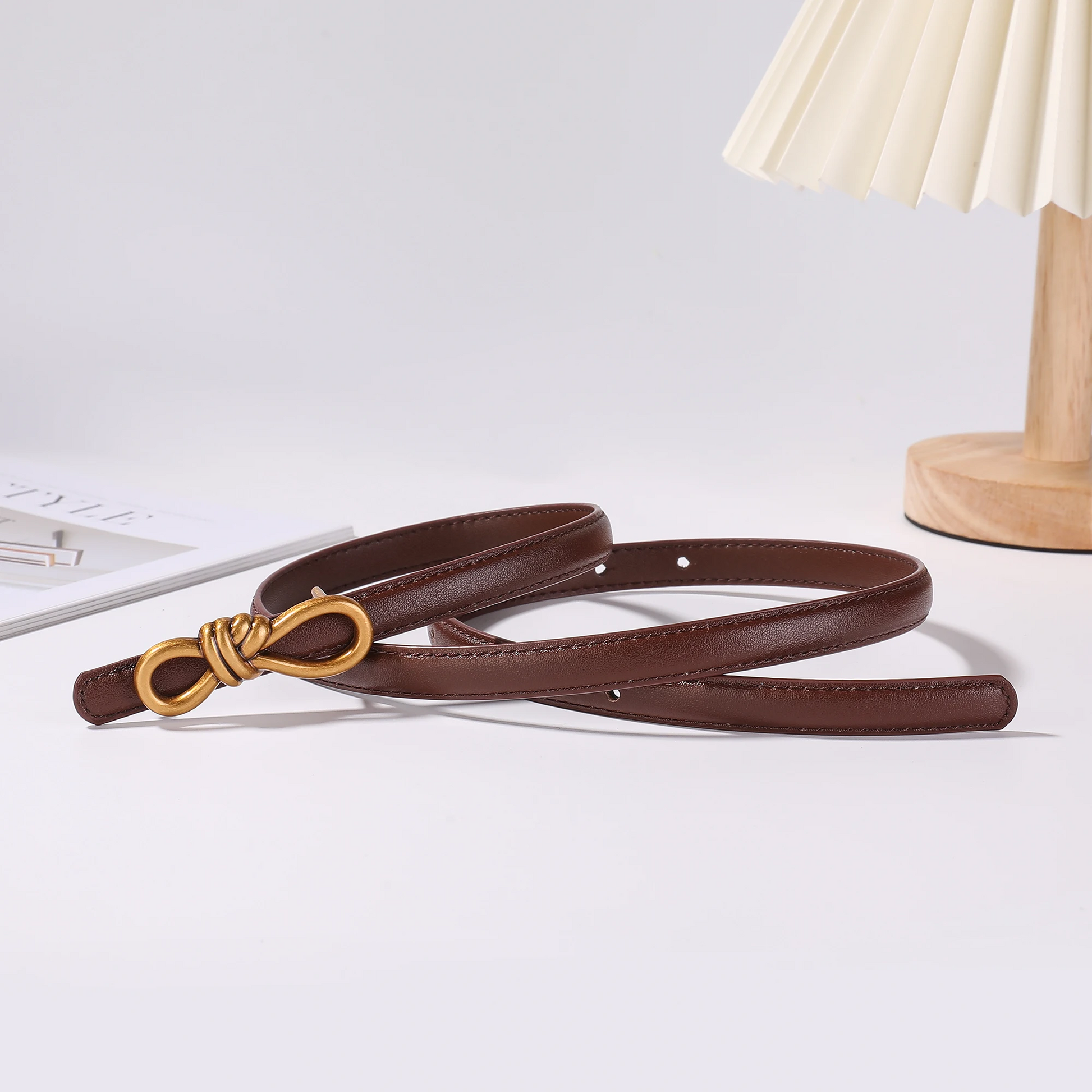 Women's genuine leather belt in tan with gold knot buckle, adjustable one-size classic style