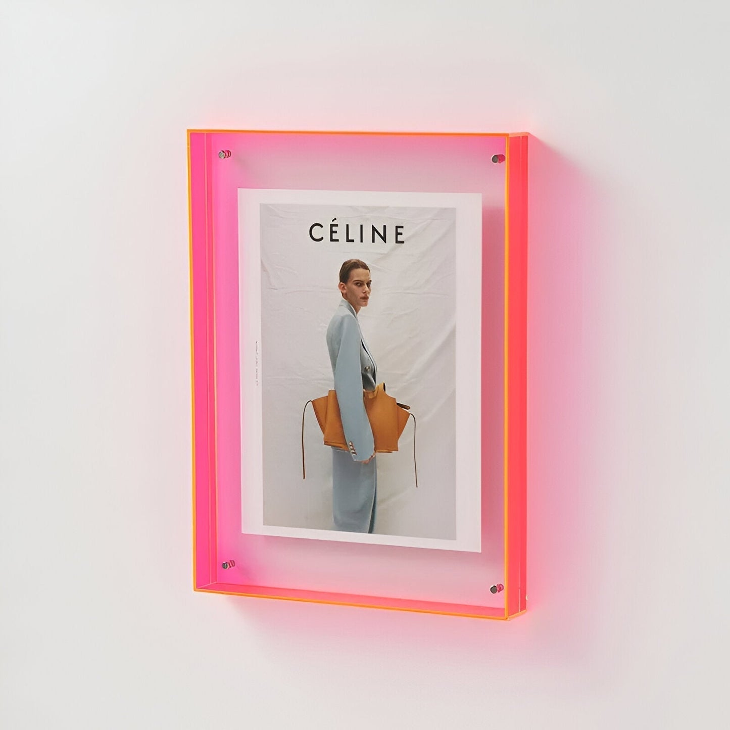 Clear acrylic floating picture frame with vibrant colored edges for modern minimalist home decor