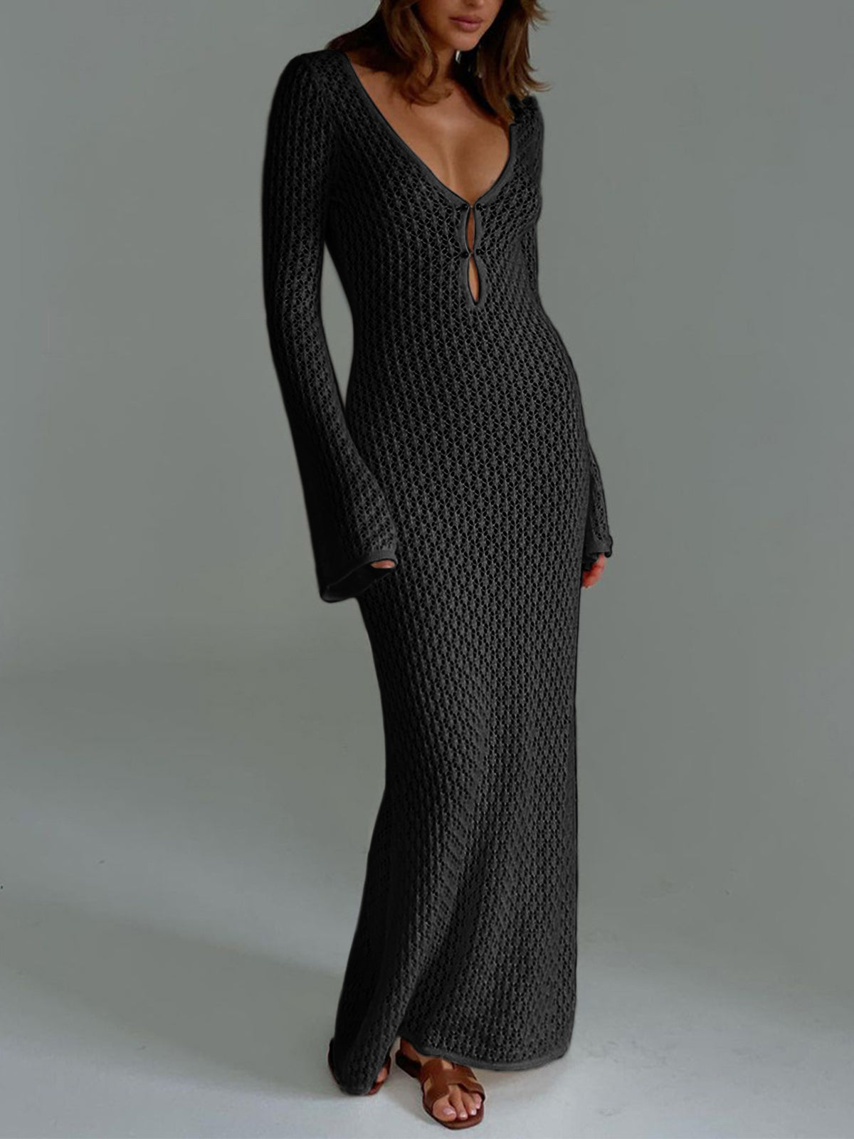 Beige knit maxi cover-up dress with long sleeves and open back, resort-style relaxed fit