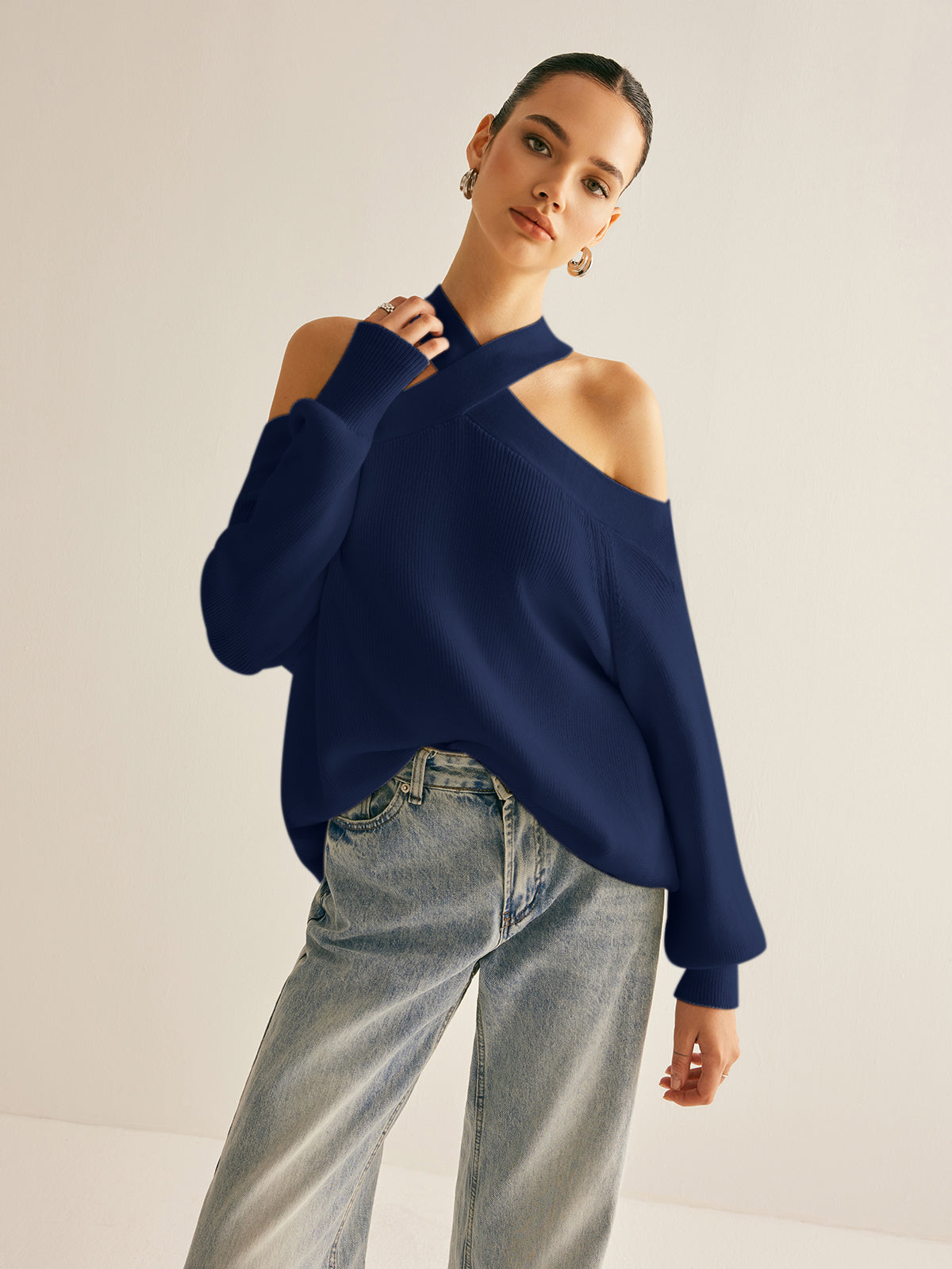 Women's beige crossover collar cold shoulder knit sweater with halter neckline and elegant stretch fit