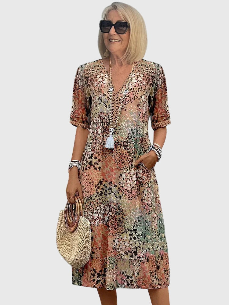 Women's printed midi dress with V-neckline, relaxed drape silhouette, short sleeves, effortless everyday style