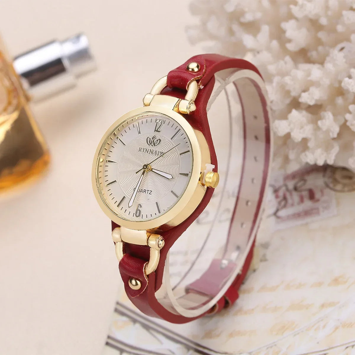 Sophie minimalist quartz watch gold-tone steel case vegan leather strap engraved dial for women