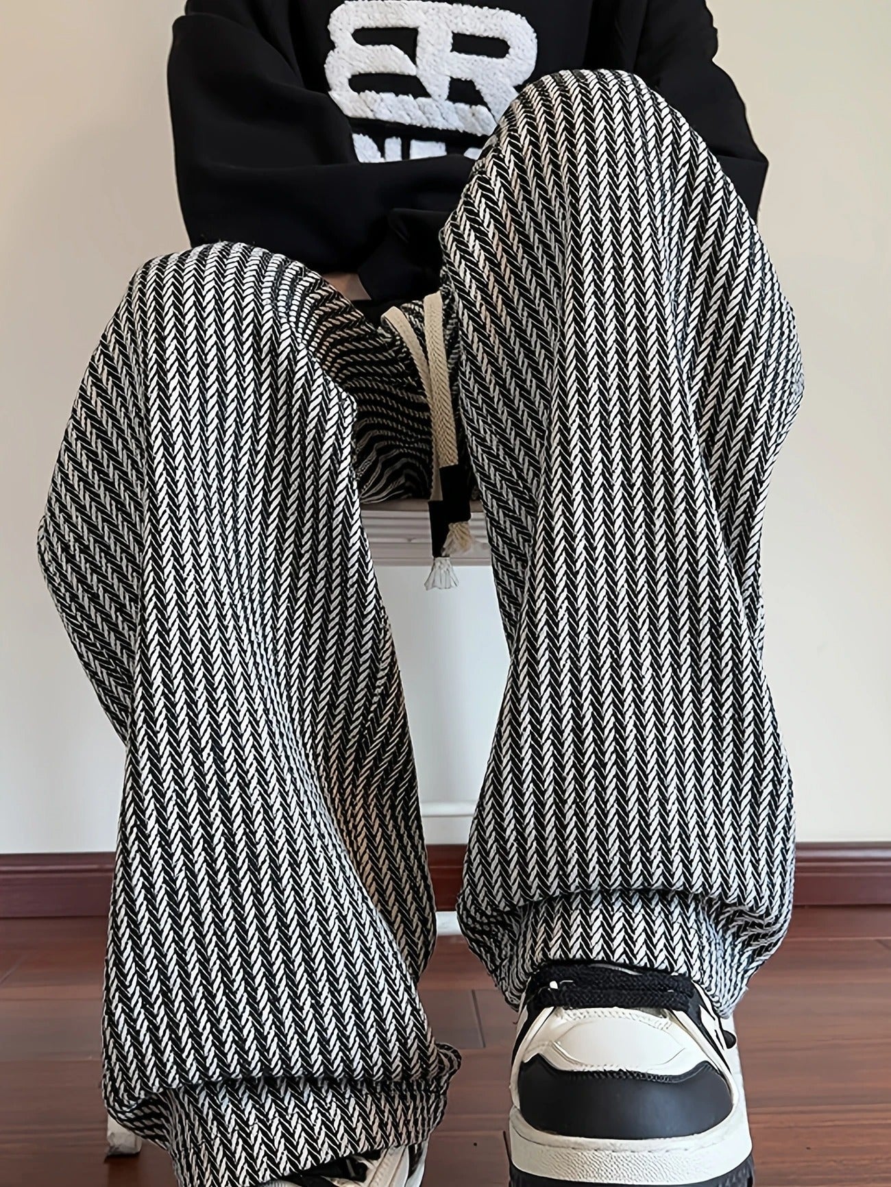 Unisex relaxed straight-leg herringbone knit pants with premium ribbed texture and vertical stripe