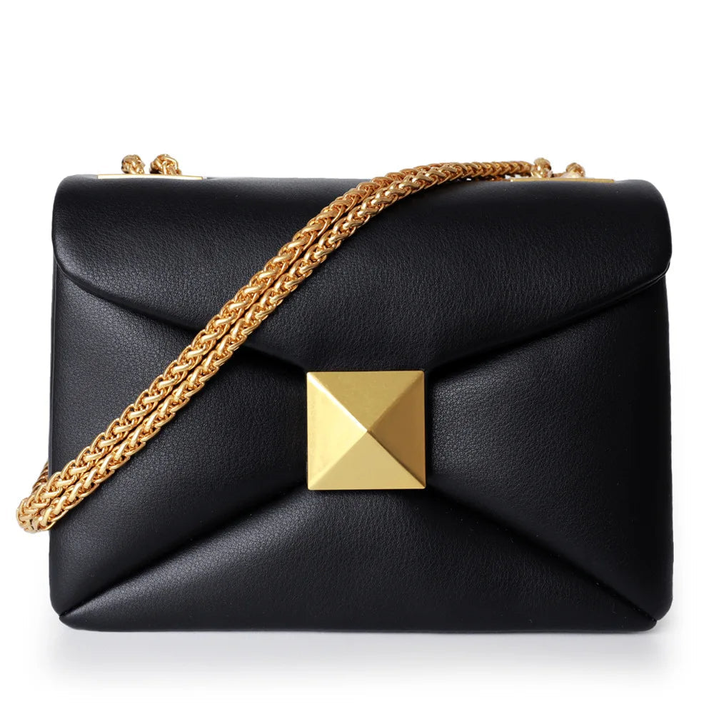 Valencia genuine leather handbag in neutral tone, spacious silhouette with gold rivet chain detail