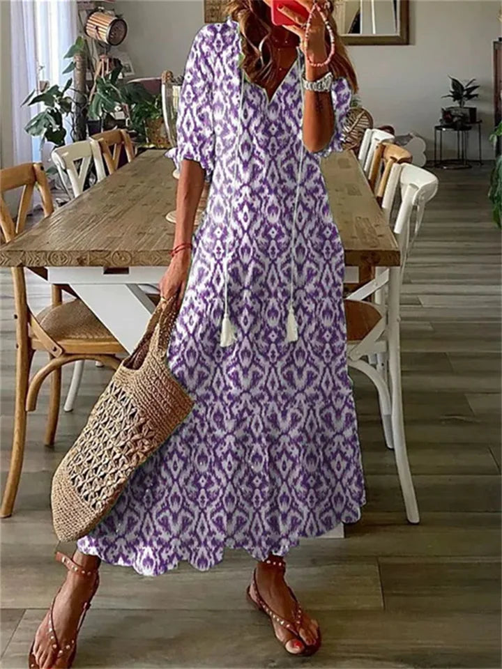 Women's floral maxi dress boho chic relaxed silhouette V-neck tassel ties elbow sleeves airy fabric