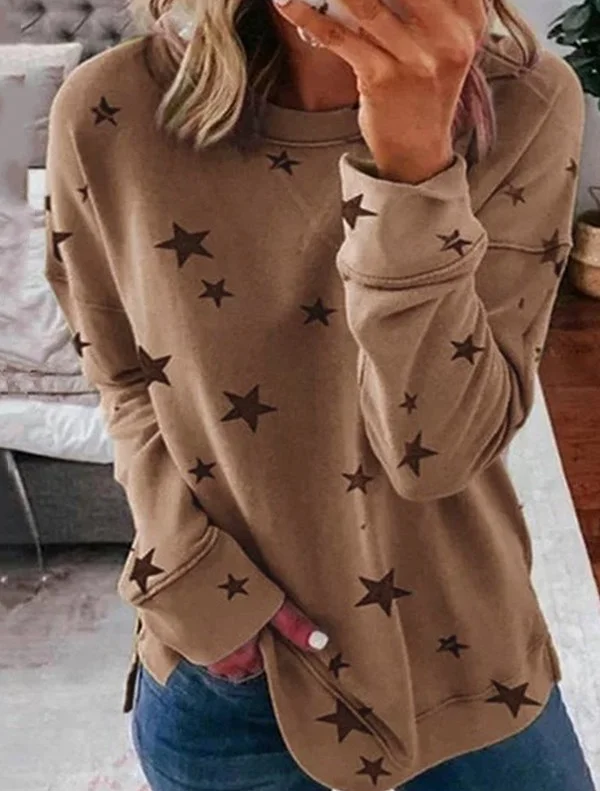 Women's loose fit crewneck sweatshirt with allover star print pattern for casual everyday wear