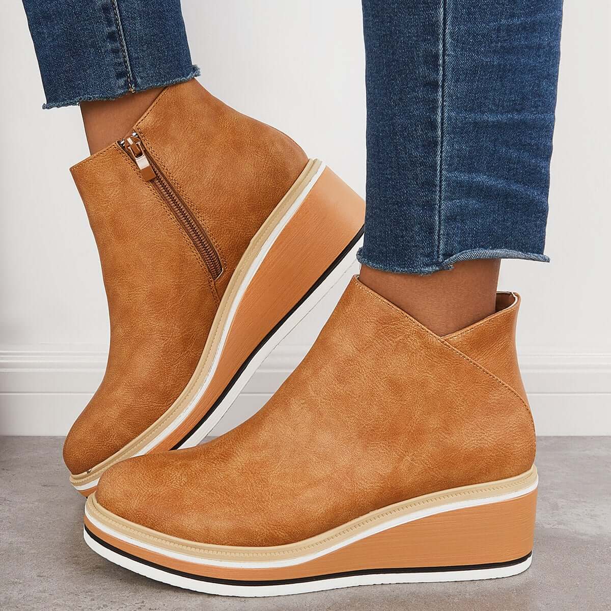 Women's black platform ankle boots with side zipper, elegant style offering height and all-day stability