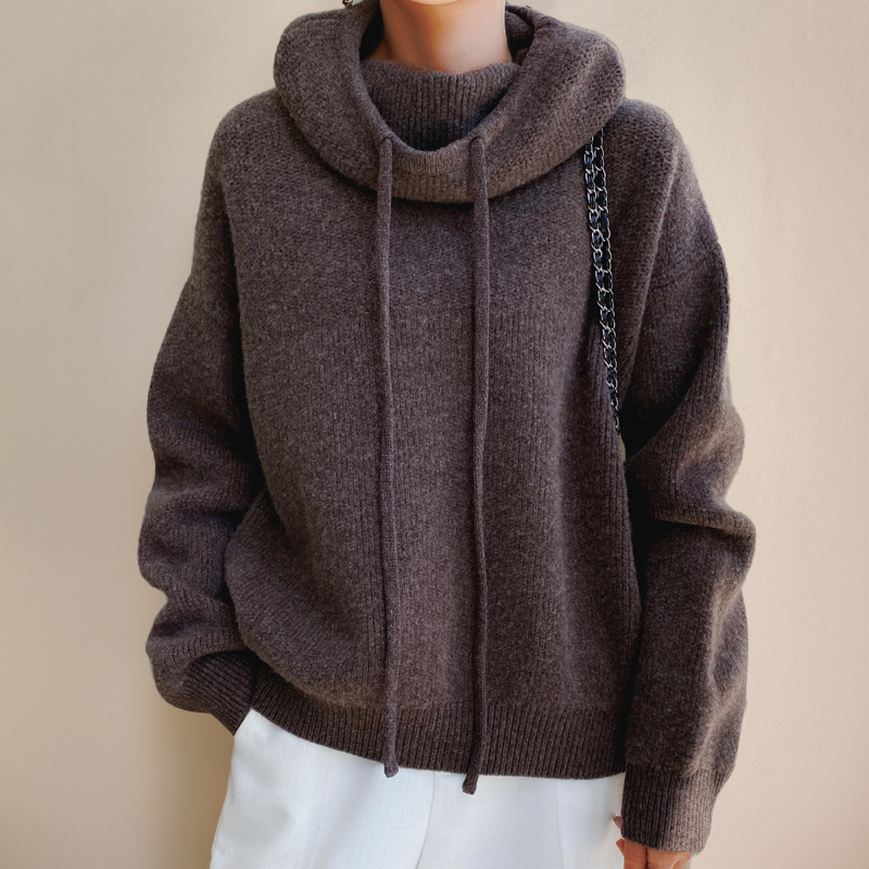 Women's oversized wool hoodie in neutral tone with draped cowl neck and relaxed cozy silhouette