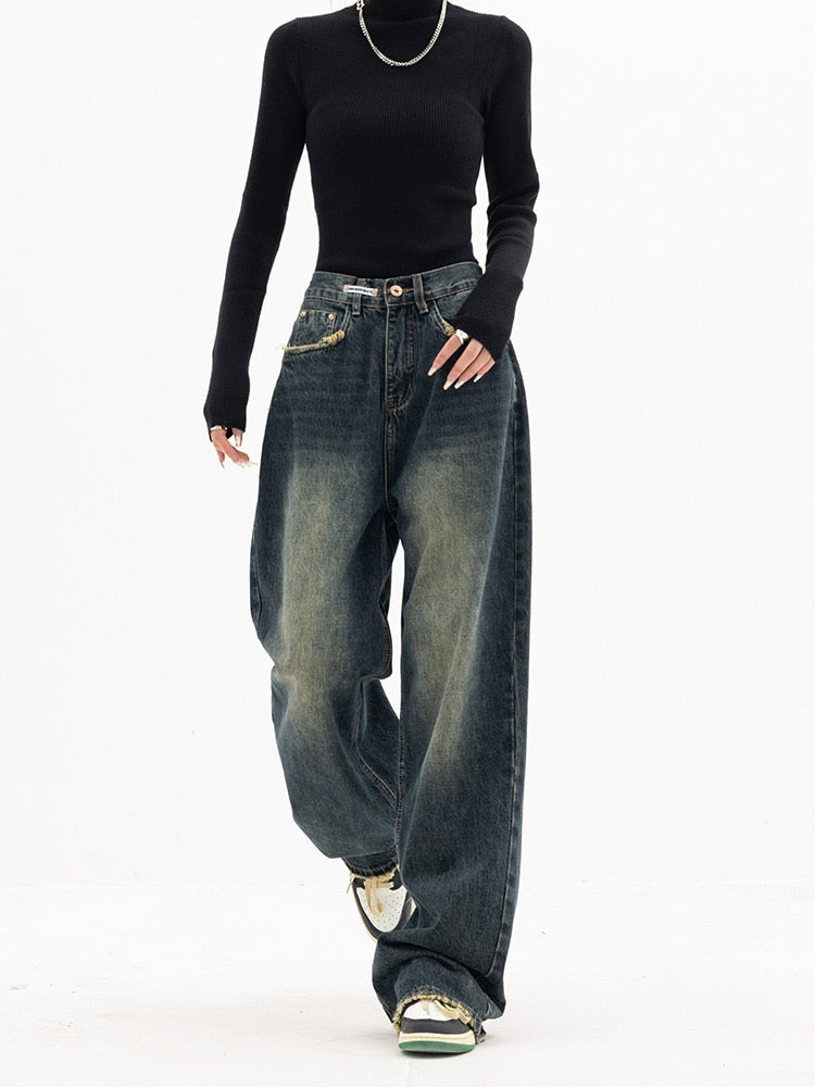 Women's high waisted distressed wide leg jeans with raw hem details for trendy casual style