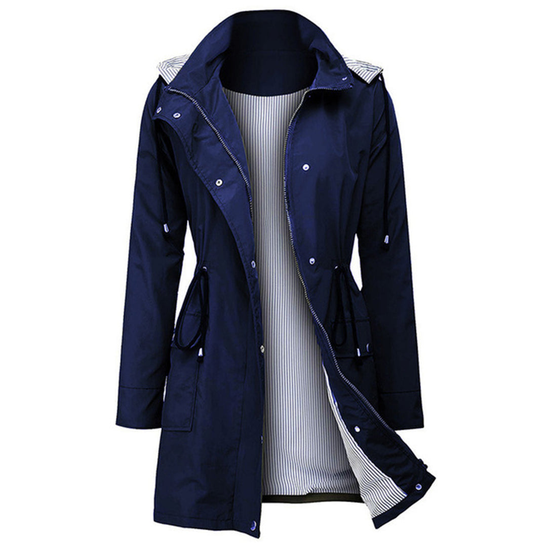 Women's waterproof rain jacket with adjustable hood, tailored waist, and breathable lining for all-weather wear