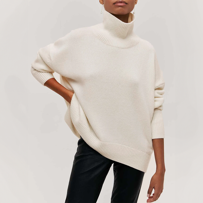 Women's oversized turtleneck knit sweater with draped silhouette and ribbed cuffs for effortless layering