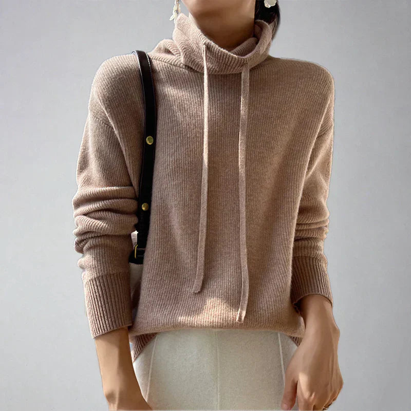 Women's slouchy fit turtleneck pullover sweater with drawstring detail for cozy winter warmth