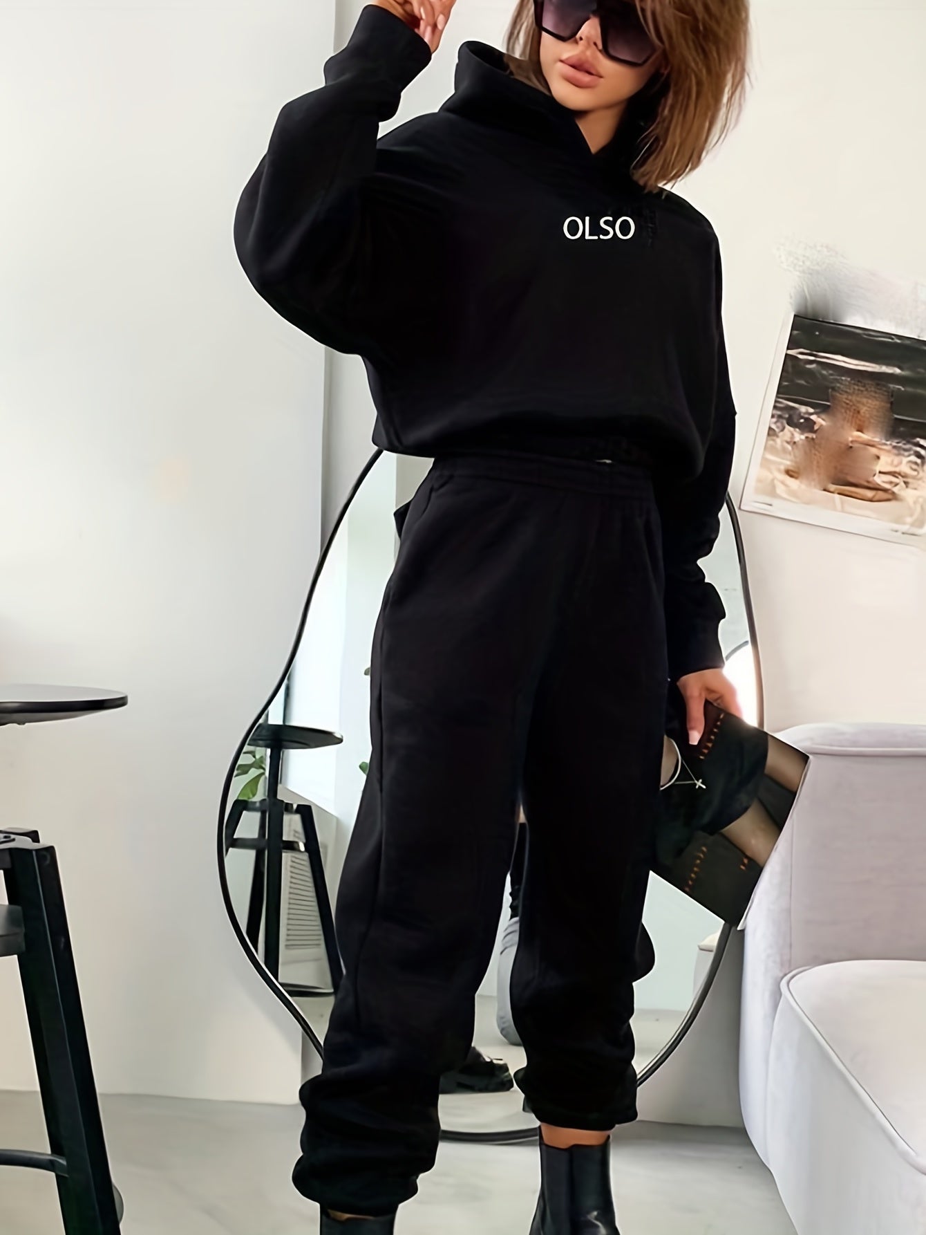 Women's sustainable two-piece hoodie and sweatpants tracksuit set in coordinated casual lounge style