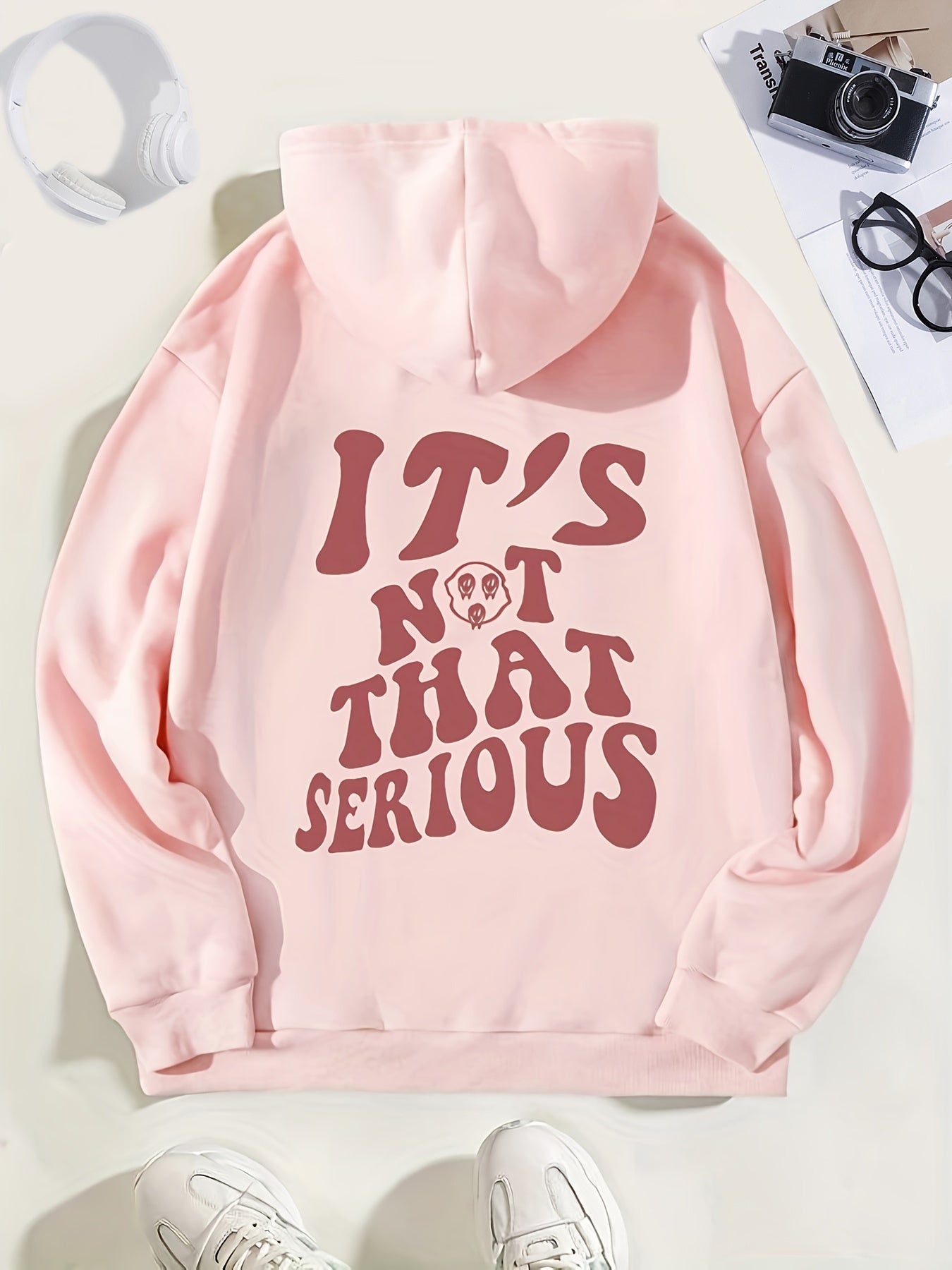 Women's relaxed fit hoodie with "It's Not That Serious" slogan, cozy loose silhouette for everyday wear