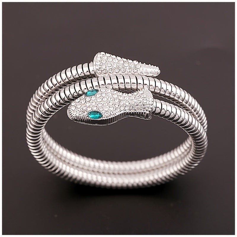 Bulgari Serpenti silver coil cuff bracelet dual-head design pavé crystals emerald eyes flexible wrap