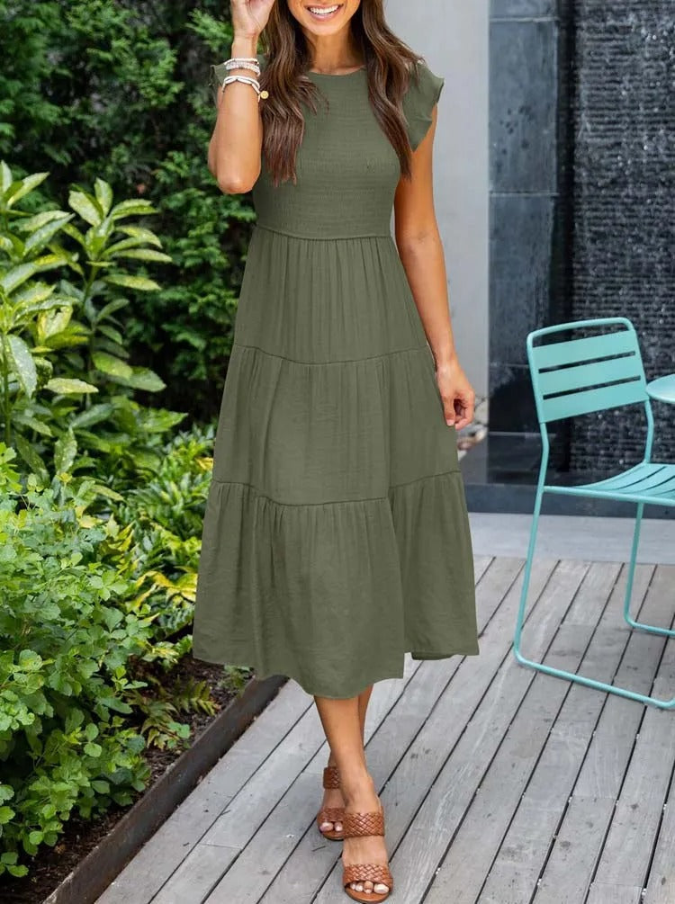 Women's lightweight summer dress with ruffle accents, functional pockets, and breezy sustainable fabric