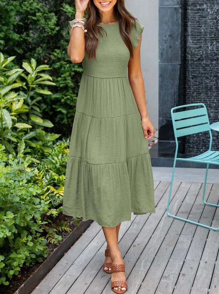 Women's lightweight summer dress with ruffle accents and functional pockets, breezy sustainable style