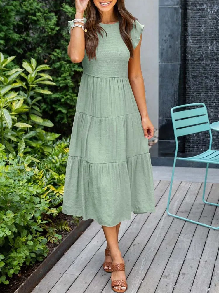 Women's lightweight summer dress with ruffle accents, functional pockets, sustainable fabric, relaxed fit