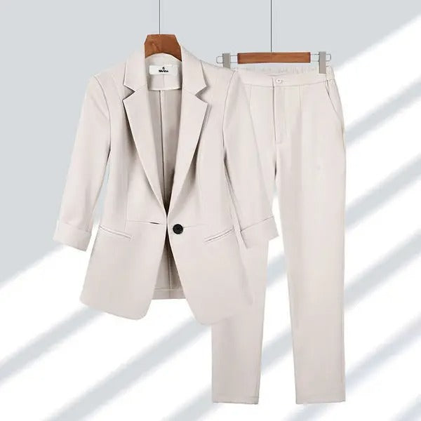Women's tailored blazer and pants set in classic hue, polished two-piece coordinated suit for work