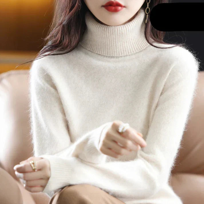 Women's cashmere turtleneck sweater in classic knit, luxuriously soft with a refined timeless silhouette