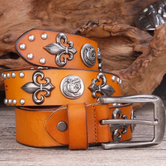 Black full-grain leather belt with antique silver fleur-de-lis medallion buckle, rugged biker style
