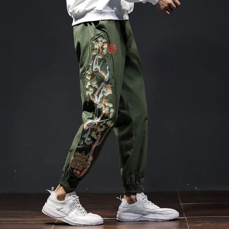 Men's black embroidered jogger pants with majestic bonsai landscape motif and relaxed tailored fit