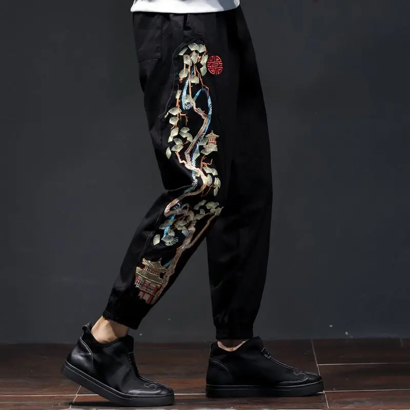 Men's gray embroidered jogger pants with majestic bonsai landscape motif and relaxed tailored fit