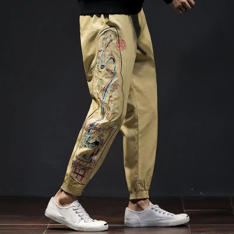 Men's gray embroidered jogger pants with majestic bonsai landscape motif and relaxed tailored fit