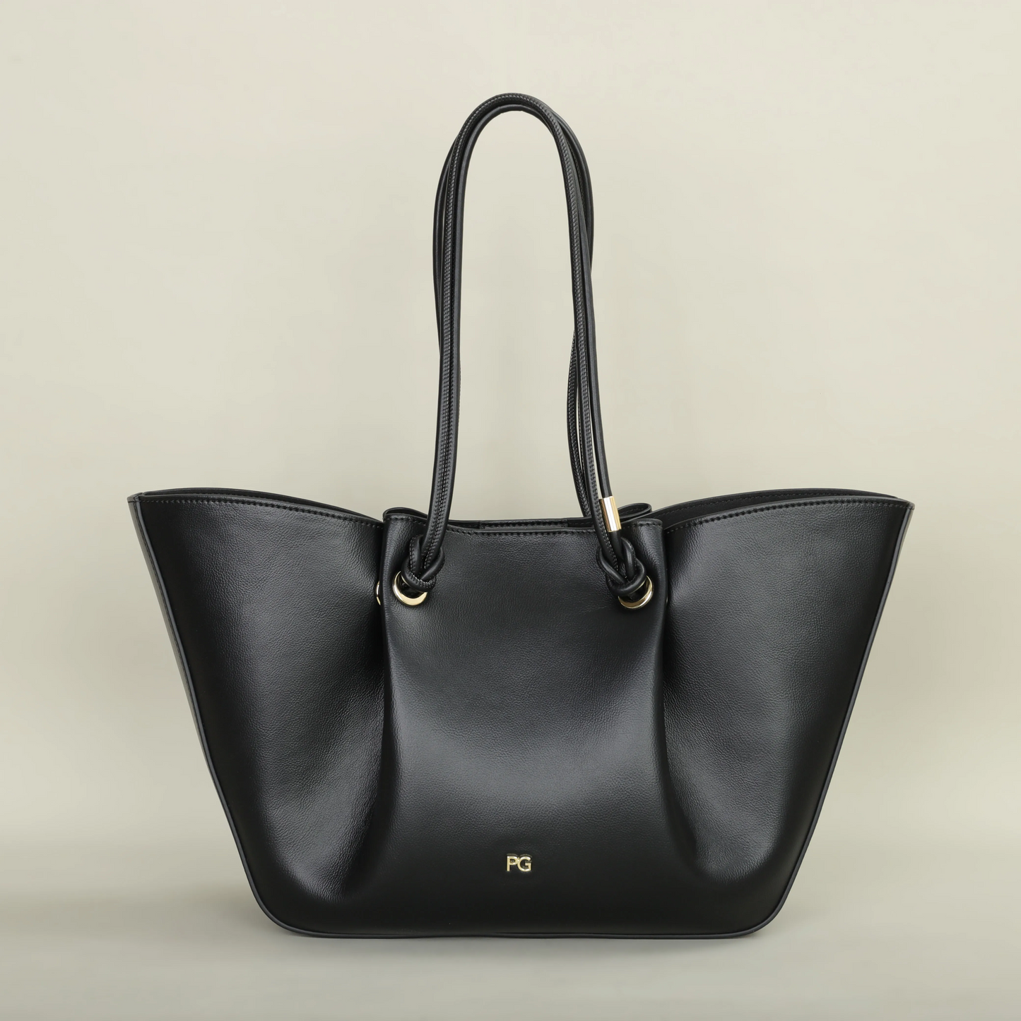 Pallier Grace structured leather tote bag with winged sides and knotted handles, lightweight carryall