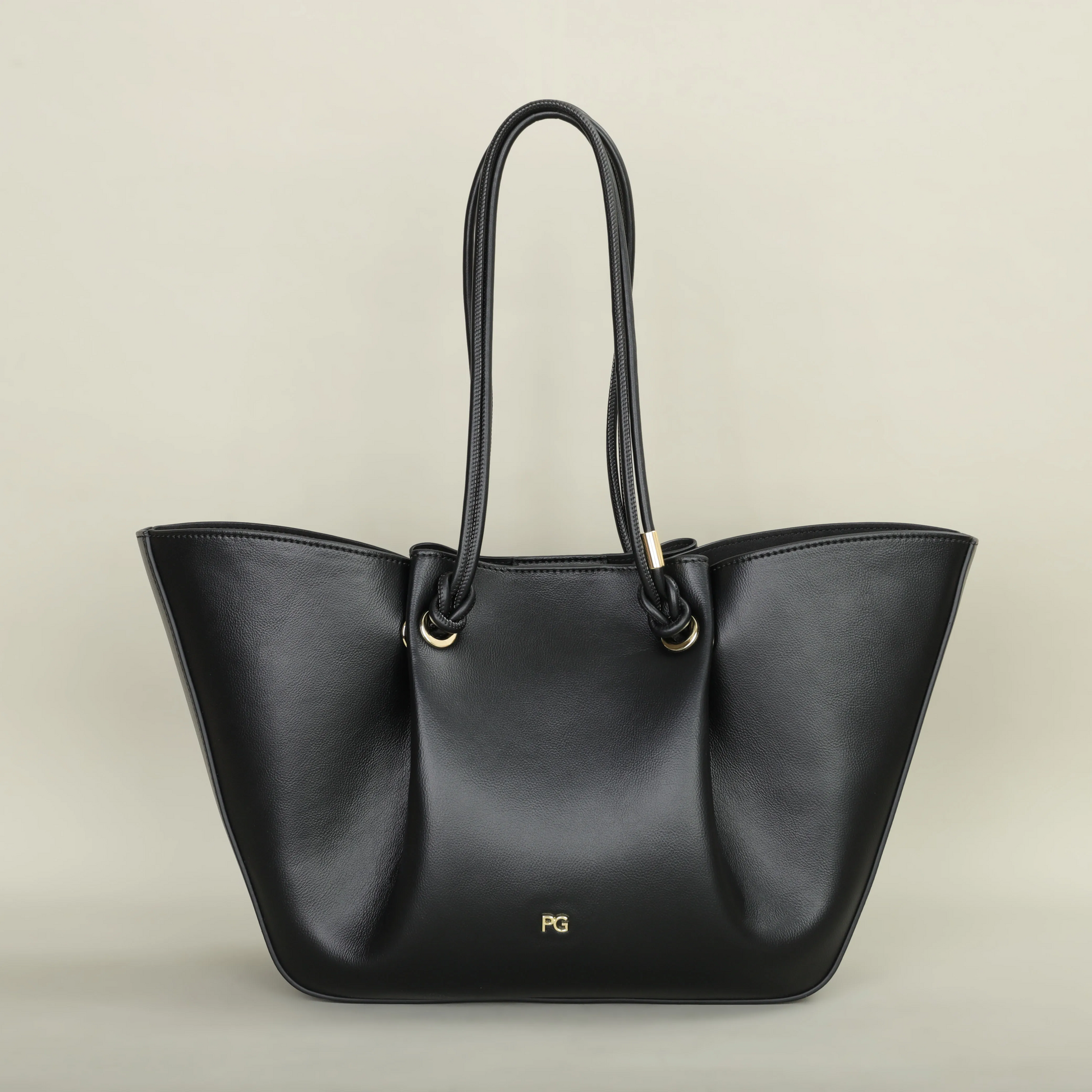 Pallier Grace structured leather tote bag with winged sides and knotted handles, lightweight carryall